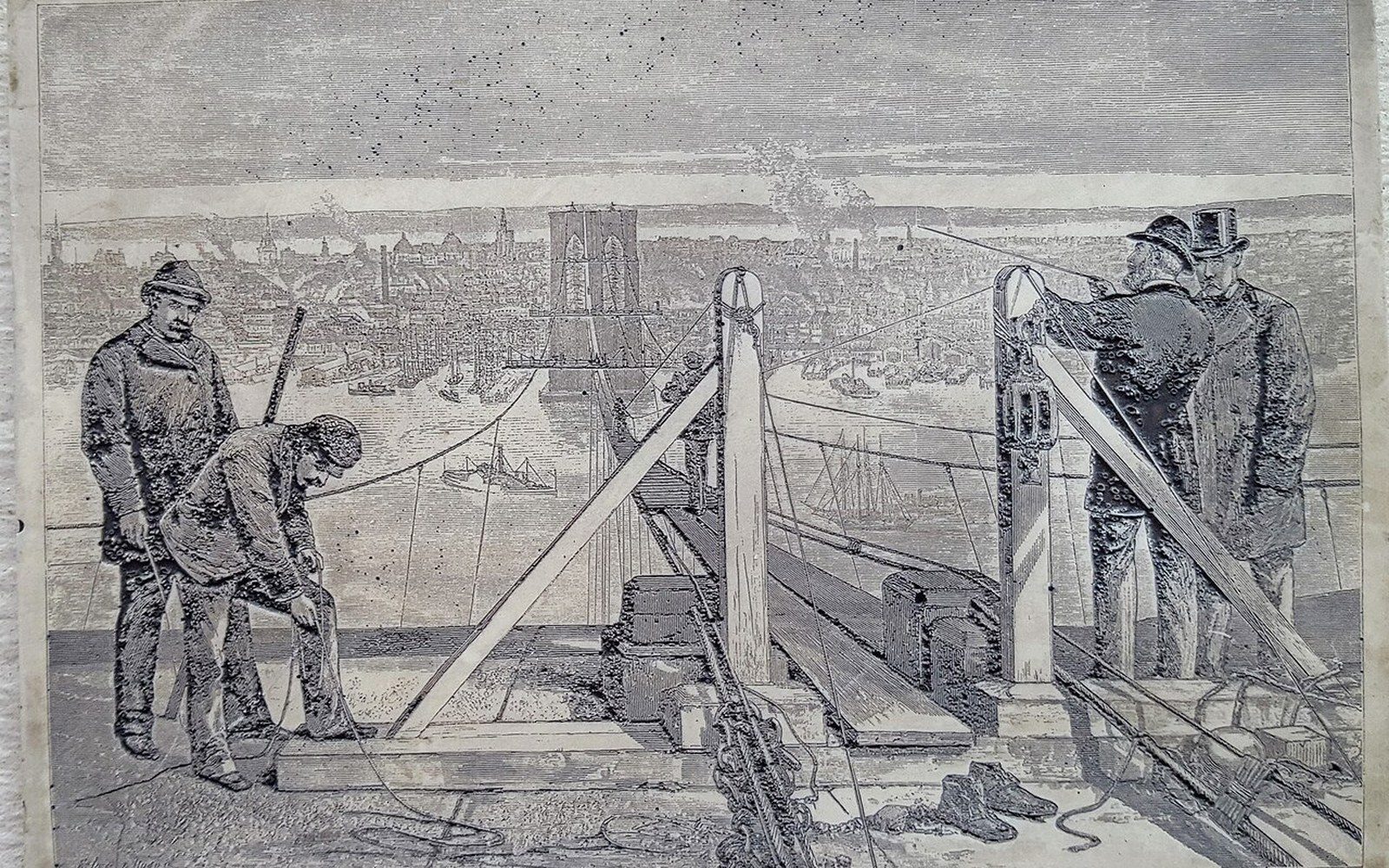 Engraving of surveyors on the temporary footbridge between the bridge towers, 1877
